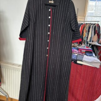 Black cotton tunic with red trim
